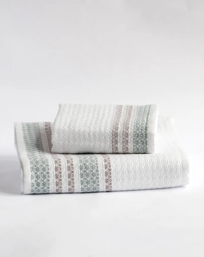 https://www.homebodydenver.com/cdn/shop/products/hand-towel-organic-cotton-beehive-446224_1024x1024.jpg?v=1637952497